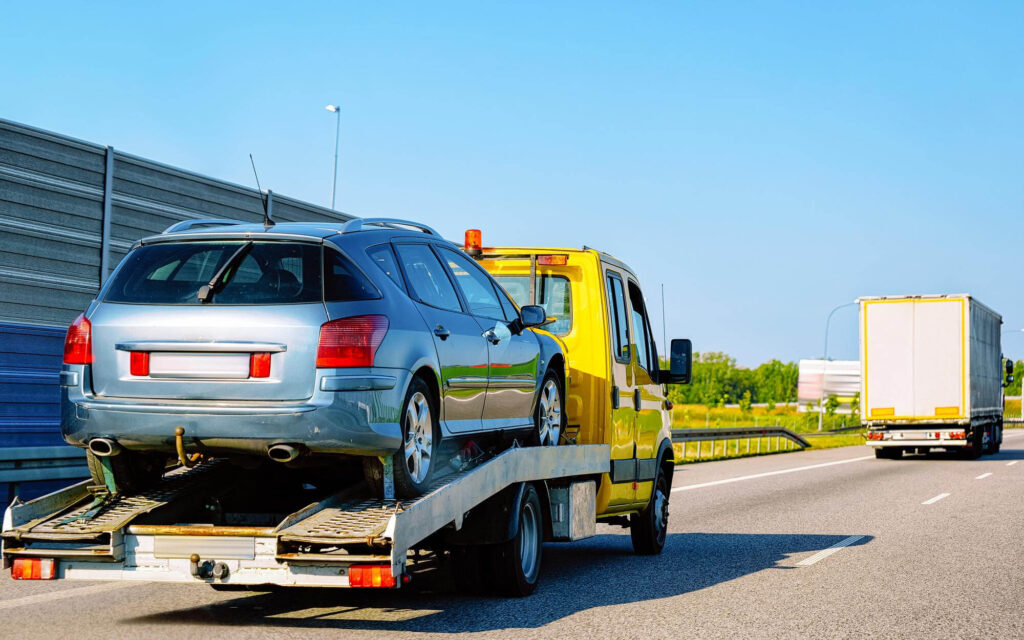 low-tow-truck-trailer-with-car-road-auto-vehicle-with-carrier-transporter-hauler-driveway-european-transport-logistics-haulage-work-transportation-haul-highway